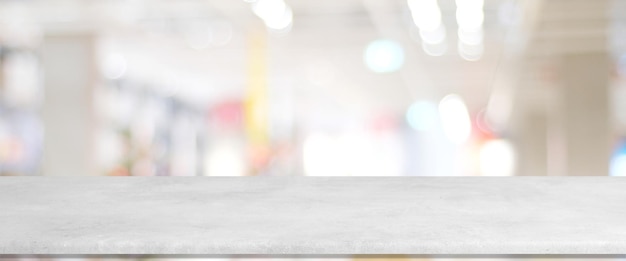 Empty white cement table over blur store background