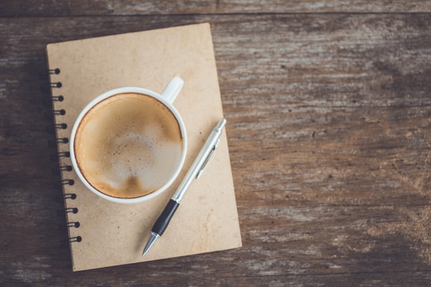 Empty of white ceramic coffee cup on wooden table 