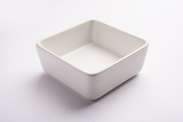 Empty white ceramic serving bowl, isolated over white surface