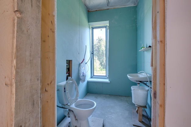 Empty white green drywall room with repair and without furniture