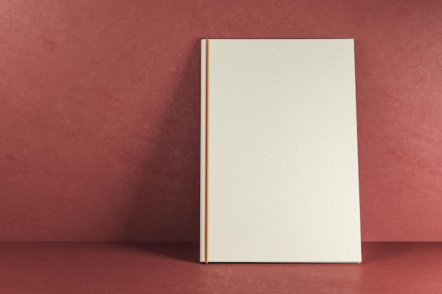 empty white hardcover text book on red background publish and mock up concept 3d rendering