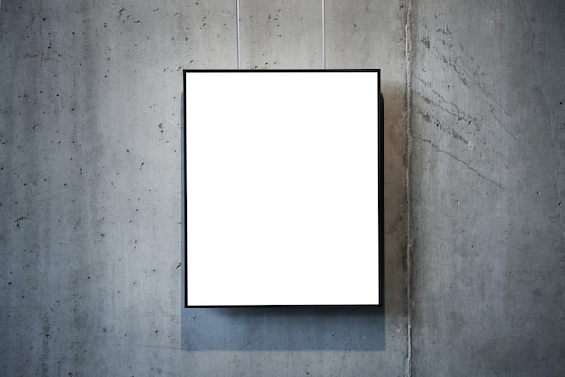 Empty white isolated frame on the wall