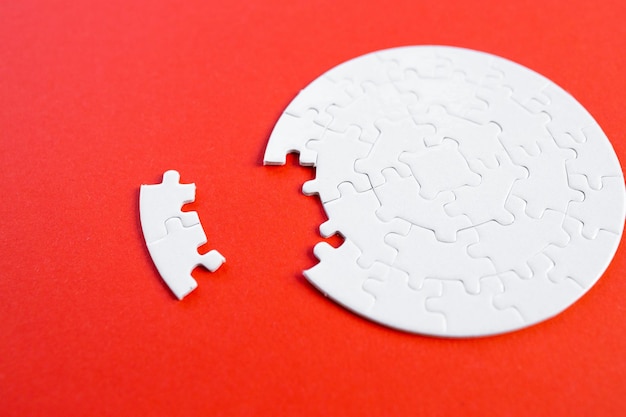 Empty white jigsaw puzzle with missing pieces