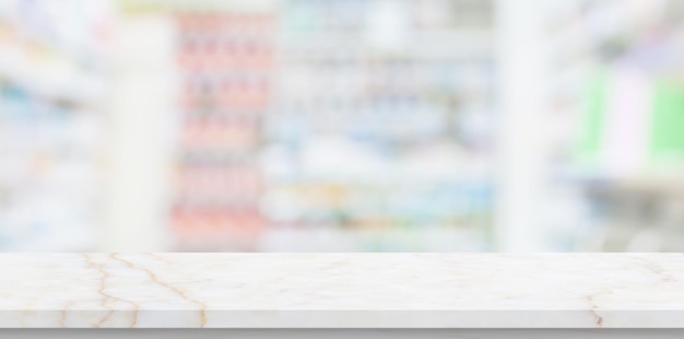 Empty white marble counter top with blur pharmacy drugstore\
shelves background