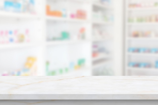 Empty white marble counter top with blur pharmacy drugstore shelves background