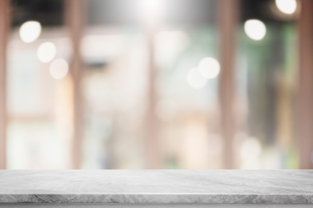 Empty white marble stone table top and blur glass window interior restaurant banner background.