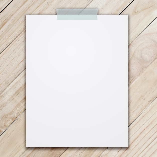 empty white paper sheet on wood background.