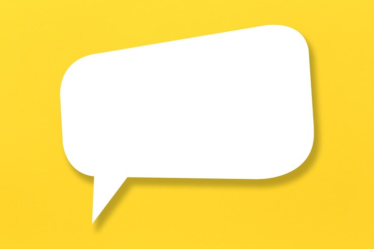 Photo empty white paper in speech bubble shape set against yellow background