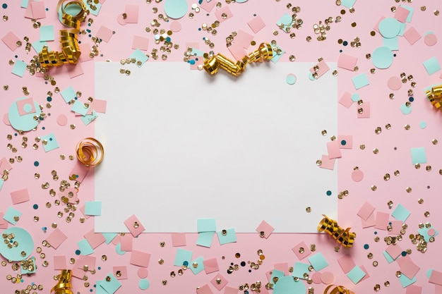 Photo empty white paper surrounded by confetti