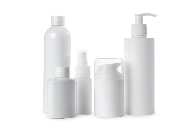 Empty white plastic bottles for cosmetics on white background. Isolated and mockup