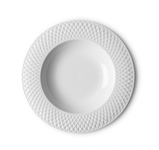 Empty white plate on white surface