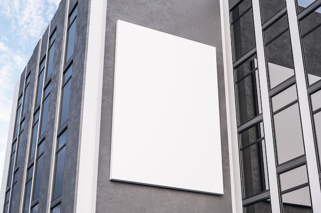 Empty white poster on concrete building