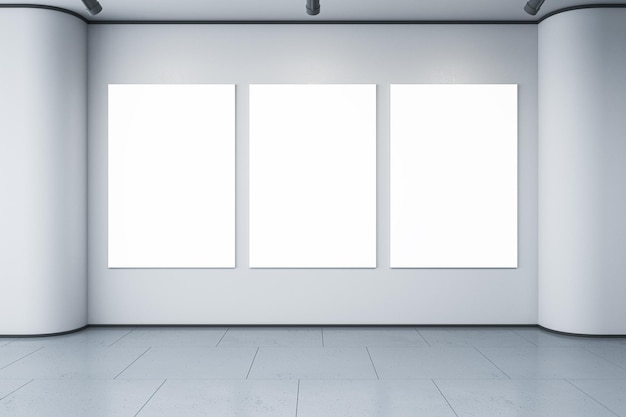 Empty white posters hanging in simple light concrete gallery interior Mock up 3D Rendering