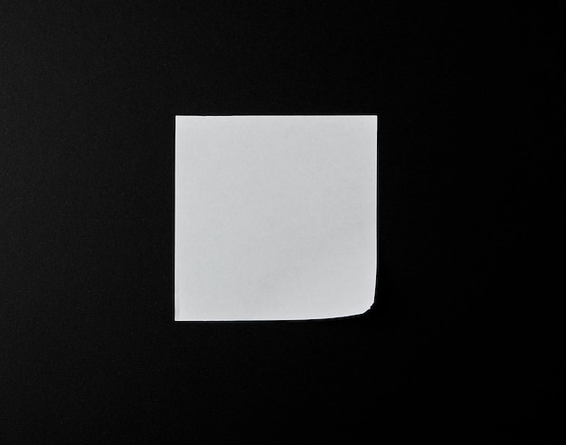 Photo empty white sheet of paper on a black background