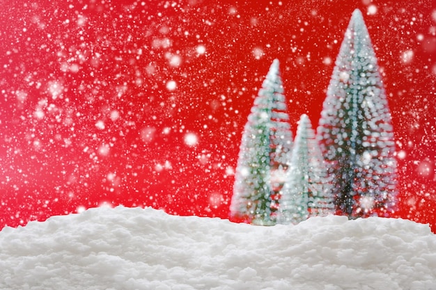 Photo empty white snow with blur christmas tree background