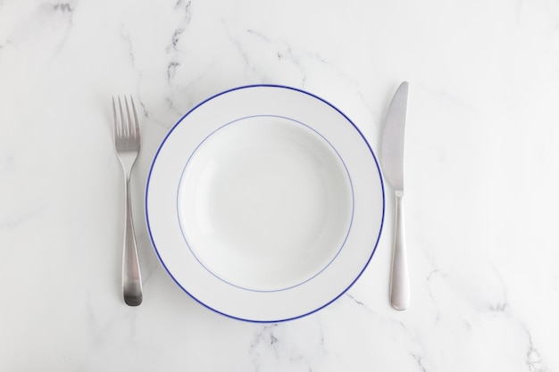 Empty white soup plate top view on a white background