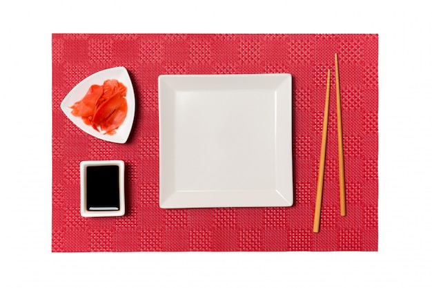 Empty white square plate with chopsticks for sushi