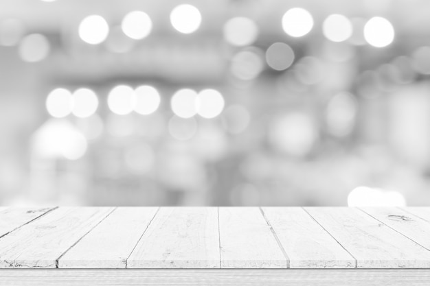 Empty white table top, counter over blur white bokeh light background. wooden shelf for product display, banner or mockup.