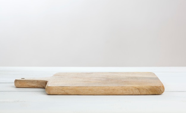 Empty white table with cutting board, product display montage