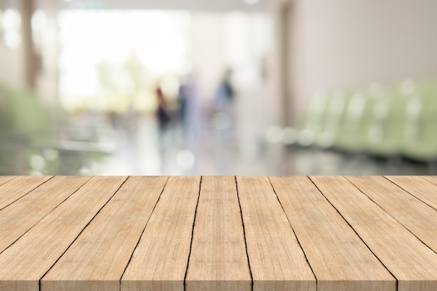 Empty white wood table top on blur hospital 