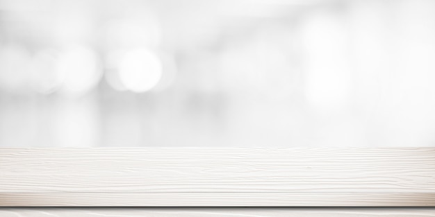 Empty white wooden table over blurred store with bokeh background 