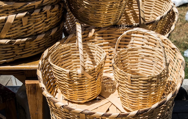 Empty wicker baskets are for sale in a market place