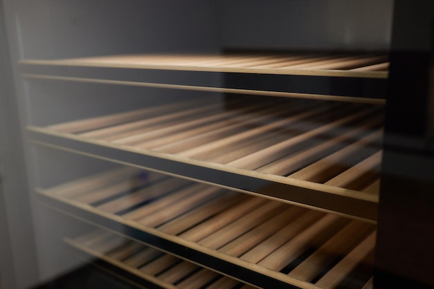 Empty Wine fridge in a kitchen home rack