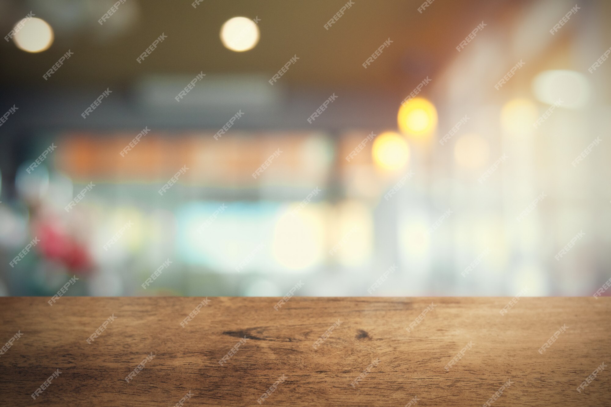 Premium Photo | Empty wood table on blur coffee shop background