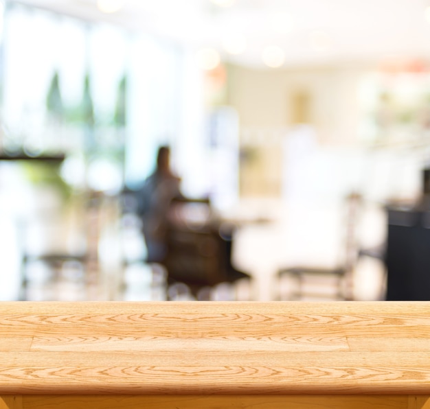 Empty wood table and blurred cafe light background. product display template.Business presentation