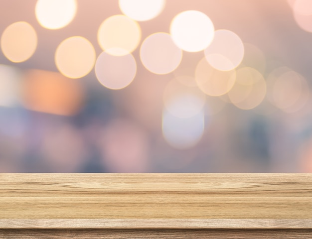 Empty wood table and blurred vintage bokeh light background