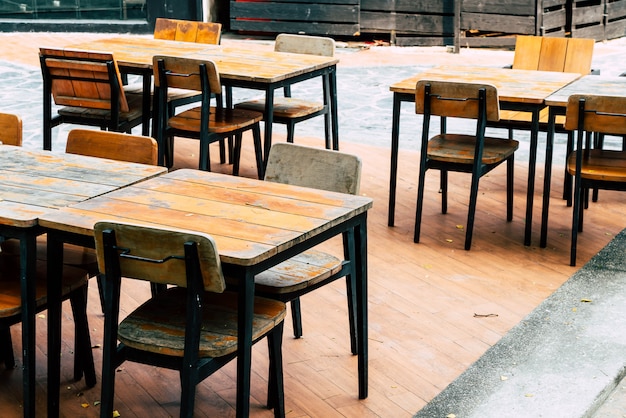 empty wood table and chair in outdoor restaurant