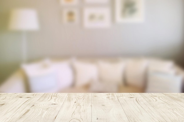 Empty wood table top on blur abstract of interior in living room for montage product display