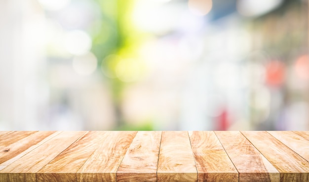 Empty wood table top on blur abstract  window glass view.For montage product display or design key visual layout