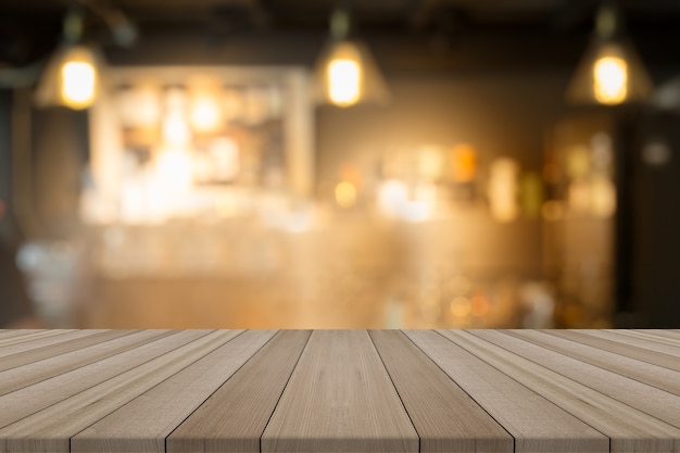 Empty wood table top on blurred background form coffee shop,for montage your products