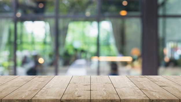 Premium Photo | Empty wood table top and blurred coffee shop and restaurant  interior background - can used for display or montage your products.