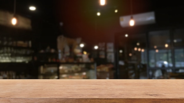 Empty wood table top and blurred coffee shop and restaurant interior background.