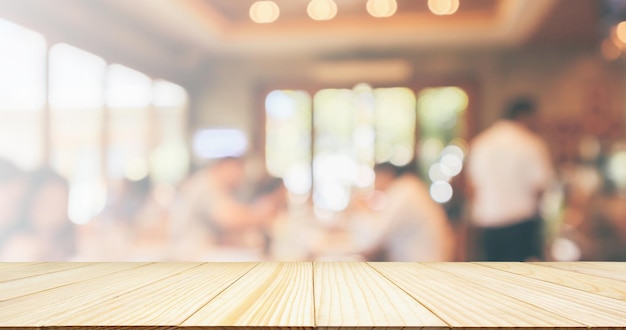 Empty Wood table top with Restaurant cafe or coffee shop interior