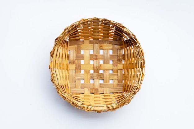 Photo empty wooden bamboo basket on white background.