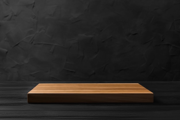 Empty wooden board on a black blurred background