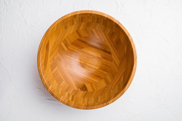 Empty Wooden Bowl set with copy space for text or food, top view flat lay, on white stone table background