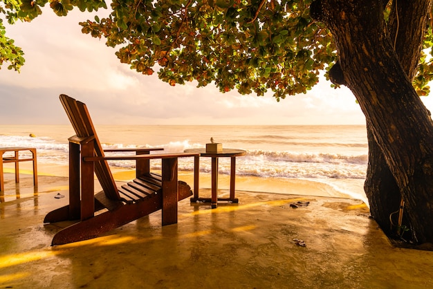 empty wooden chair with beach sea