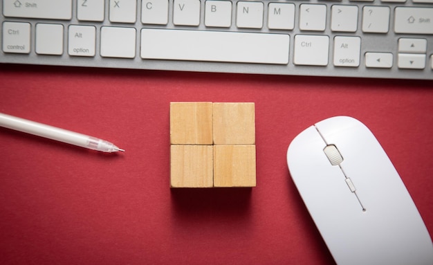 Empty wooden cubes with a computer keyboard and mouse