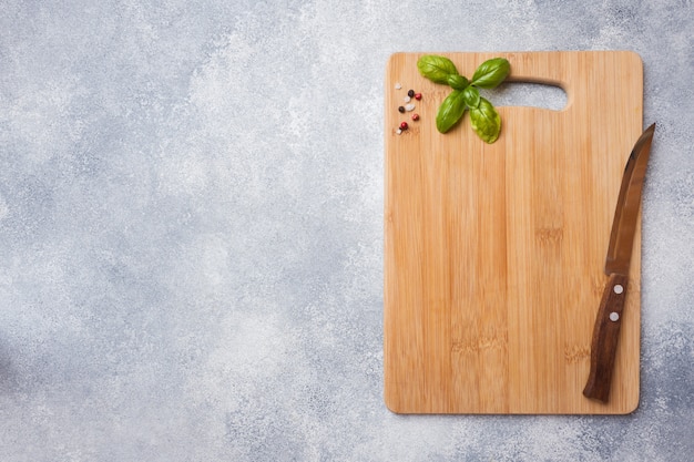 Empty wooden cutting board on kitchen table