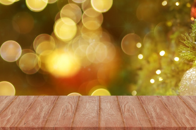 Empty wooden deck table over bokeh lights for product montage