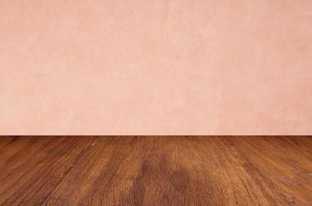 Empty wooden floors on pink wall background