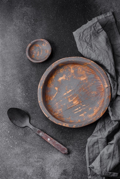 Empty wooden plate knife fork and cutting board