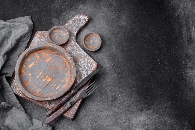 Empty wooden plate knife fork and cutting board