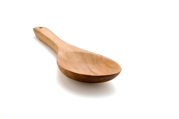 Empty wooden spoon isolated on whitexA