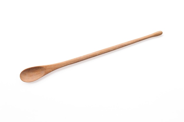 Empty wooden spoon on white