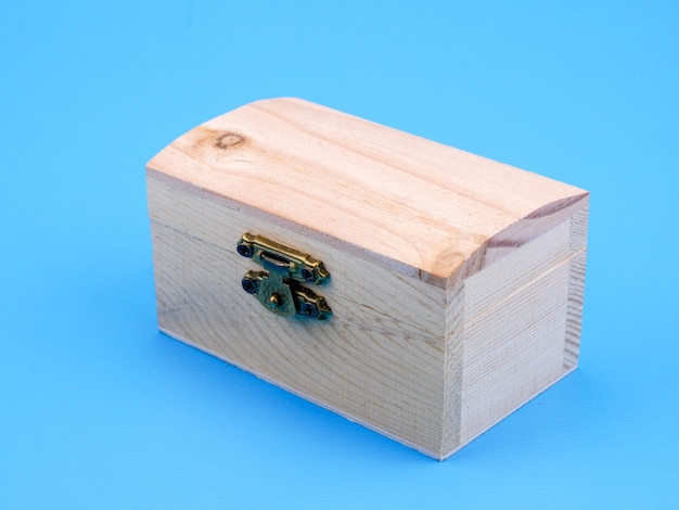 Empty wooden square box on blue background